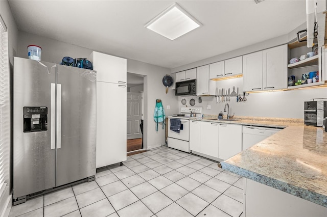 4735 W Leila Ave, Tampa, FL 33616 - kitchen featuring white appliances, white cabinets, light countertops, open shelves, and a sink