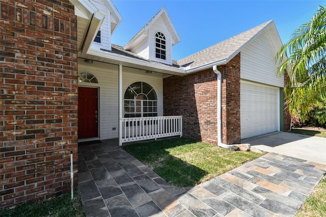 9709 Bay Colony Dr, Riverview, FL 33578 - view of front of house with a porch, an attached garage, driveway, brick siding, and a shingled roof