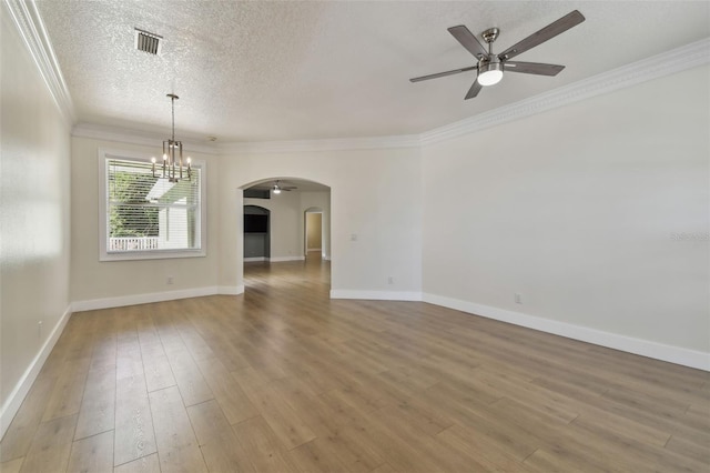 9709 Bay Colony Dr, Riverview, FL 33578 - spare room with arched walkways, a chandelier, ceiling fan, a textured ceiling, and wood finished floors