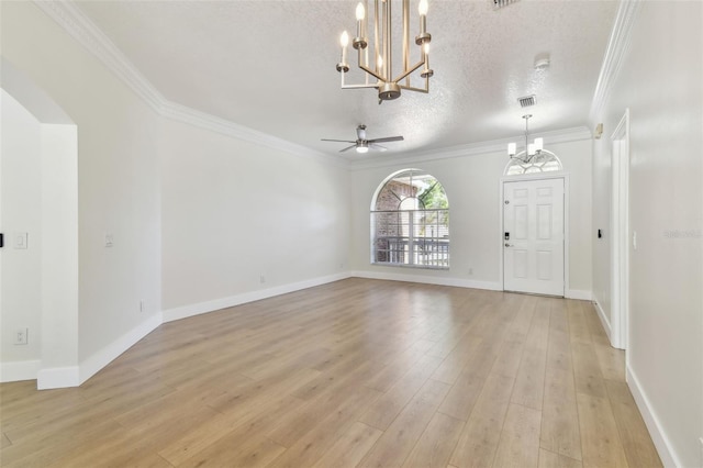 9709 Bay Colony Dr, Riverview, FL 33578 - unfurnished living room with a chandelier, a textured ceiling, ornamental molding, light wood finished floors, and ceiling fan