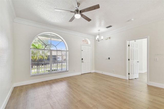 9709 Bay Colony Dr, Riverview, FL 33578 - empty room featuring a chandelier, a ceiling fan, crown molding, light wood-style flooring, and baseboards