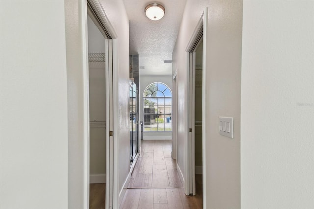9709 Bay Colony Dr, Riverview, FL 33578 - hall with wood-type flooring and baseboards
