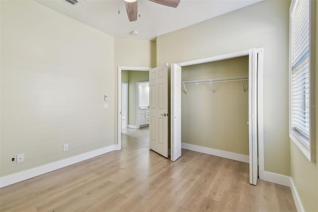 9709 Bay Colony Dr, Riverview, FL 33578 - unfurnished bedroom featuring light wood-style floors, baseboards, a closet, and ceiling fan