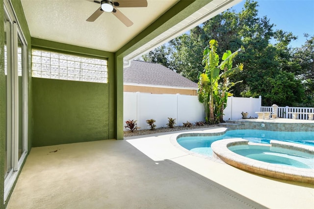9709 Bay Colony Dr, Riverview, FL 33578 - view of swimming pool featuring ceiling fan, a patio, a fenced backyard, and a pool with connected hot tub