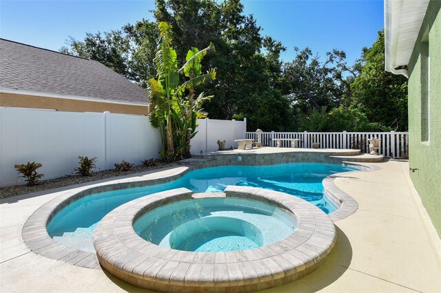 9709 Bay Colony Dr, Riverview, FL 33578 - view of pool featuring a pool with connected hot tub and a fenced backyard