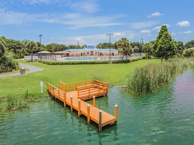 9709 Bay Colony Dr, Riverview, FL 33578 - dock area with a water view, a pool, and a lawn