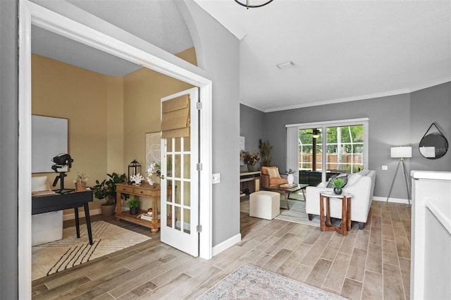 12009 Wandsworth Dr, Tampa, FL 33626 - foyer entrance with wood finished floors, crown molding, and baseboards
