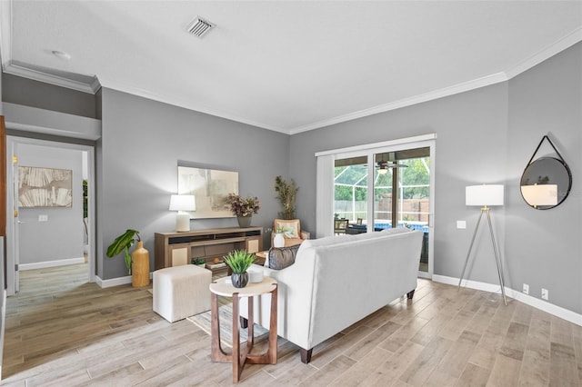 12009 Wandsworth Dr, Tampa, FL 33626 - living room featuring ornamental molding, light wood-style flooring, baseboards, and a ceiling fan