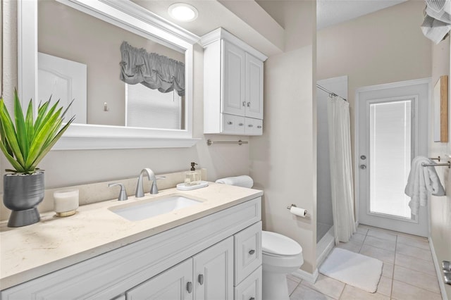 12009 Wandsworth Dr, Tampa, FL 33626 - bathroom featuring toilet, vanity, tile patterned flooring, and curtained shower