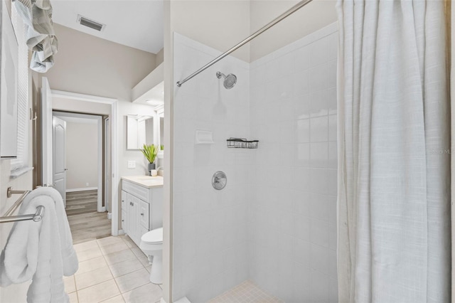 12009 Wandsworth Dr, Tampa, FL 33626 - bathroom with vanity, tiled shower, and toilet