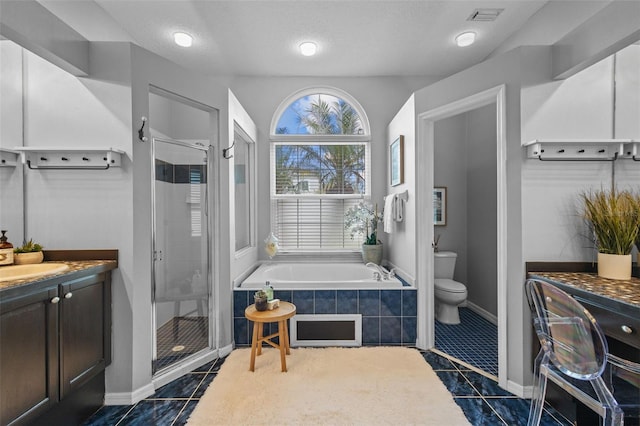 12009 Wandsworth Dr, Tampa, FL 33626 - bathroom featuring a stall shower, vanity, a bath, toilet, and tile patterned floors