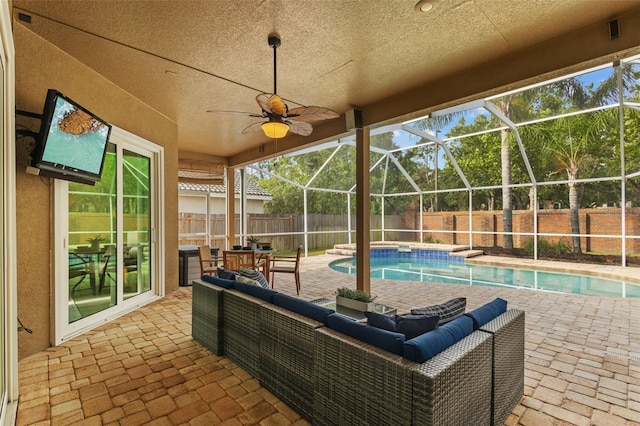 12009 Wandsworth Dr, Tampa, FL 33626 - fenced backyard with a patio, glass enclosure, and outdoor lounge area
