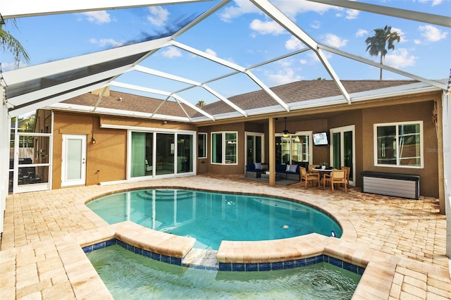 12009 Wandsworth Dr, Tampa, FL 33626 - view of swimming pool featuring ceiling fan, a patio area, an outdoor living space, and glass enclosure