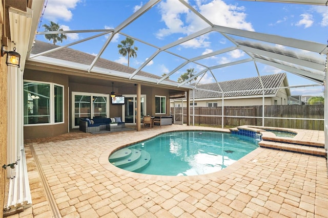12009 Wandsworth Dr, Tampa, FL 33626 - view of swimming pool with outdoor lounge area, a patio, ceiling fan, a pool with connected hot tub, and glass enclosure
