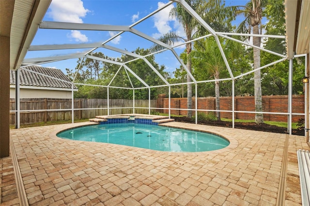 12009 Wandsworth Dr, Tampa, FL 33626 - view of swimming pool with a fenced backyard, a patio, and glass enclosure