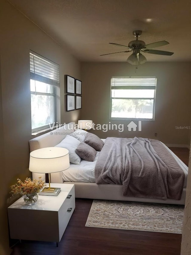 1841 Georgia Ave, Palm Harbor, FL 34683 - bedroom with dark wood-style floors and a ceiling fan