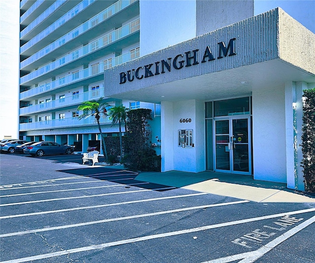 6060 Shore Blvd S Unit 903, Gulfport, FL 33707 - view of building exterior with uncovered parking