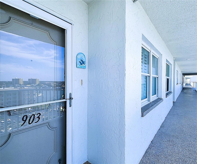 6060 Shore Blvd S Unit 903, Gulfport, FL 33707 - view of exterior entry featuring stucco siding