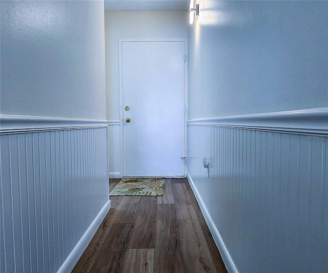 6060 Shore Blvd S Unit 903, Gulfport, FL 33707 - corridor featuring a wainscoted wall and wood finished floors