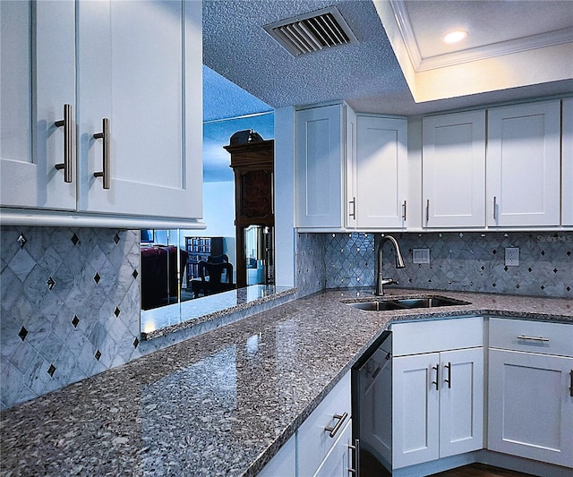 6060 Shore Blvd S Unit 903, Gulfport, FL 33707 - kitchen featuring a sink, dishwasher, dark stone counters, decorative backsplash, and white cabinets