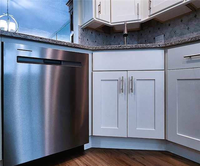 6060 Shore Blvd S Unit 903, Gulfport, FL 33707 - kitchen view of dishwasher, dark wood finished floors, decorative backsplash, and white cabinetry
