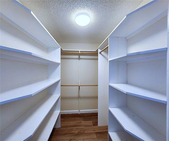 6060 Shore Blvd S Unit 903, Gulfport, FL 33707 - spacious closet featuring wood finished floors