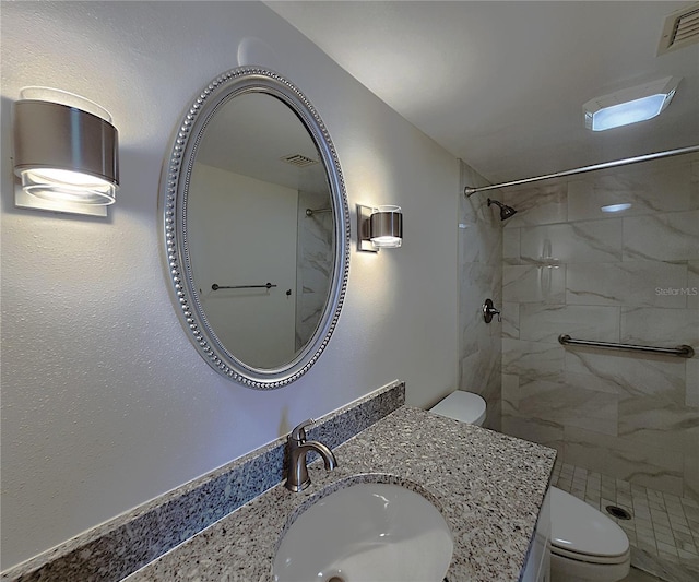 6060 Shore Blvd S Unit 903, Gulfport, FL 33707 - bathroom with toilet, tiled shower, and vanity