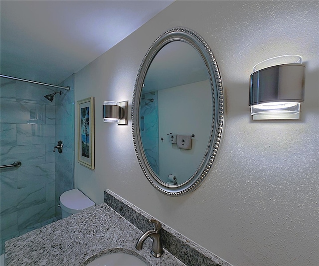 6060 Shore Blvd S Unit 903, Gulfport, FL 33707 - bathroom featuring tiled shower, toilet, and vanity