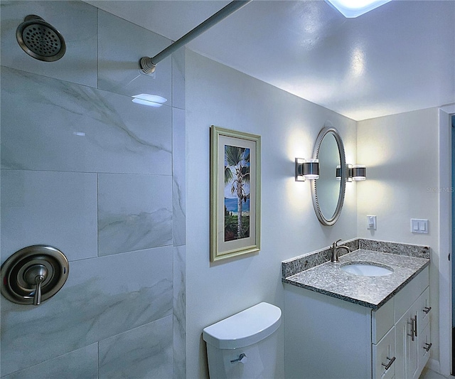 6060 Shore Blvd S Unit 903, Gulfport, FL 33707 - full bathroom with a tile shower, vanity, and toilet