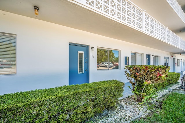 11224 82nd Ave Unit 104, Seminole, FL 33772 - doorway to property with stucco siding