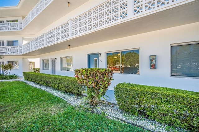 11224 82nd Ave Unit 104, Seminole, FL 33772 - rear view of property featuring stucco siding