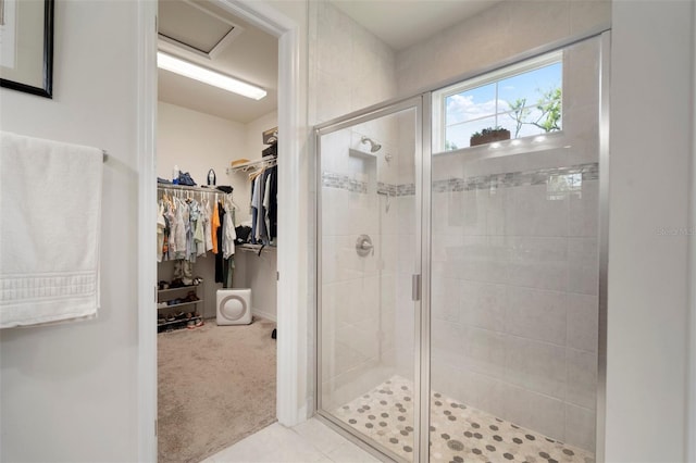 5102 Coastal Scene Dr, Apollo Beach, FL 33572 - bathroom with a stall shower, a walk in closet, and baseboards