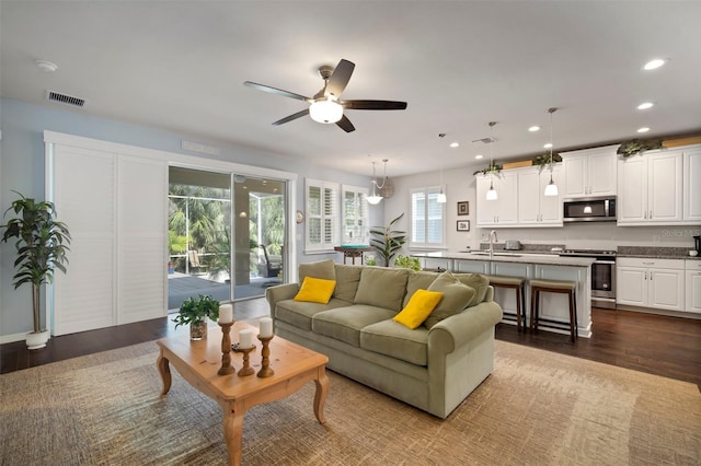 5102 Coastal Scene Dr, Apollo Beach, FL 33572 - living area with a ceiling fan, dark wood-type flooring, and recessed lighting