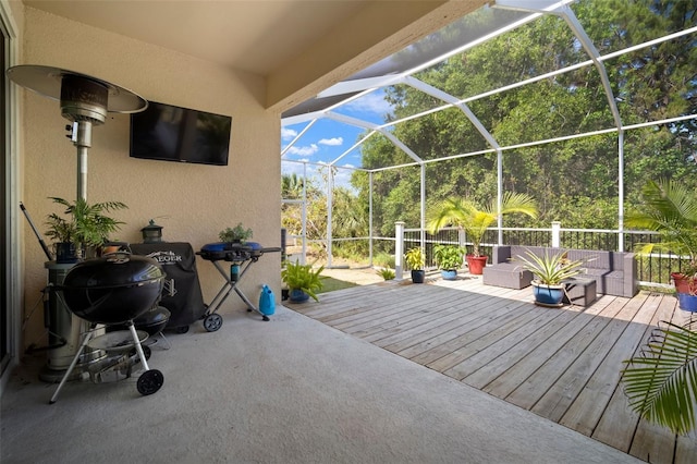 5102 Coastal Scene Dr, Apollo Beach, FL 33572 - view of patio / terrace featuring a wooden deck, a lanai, and outdoor lounge area