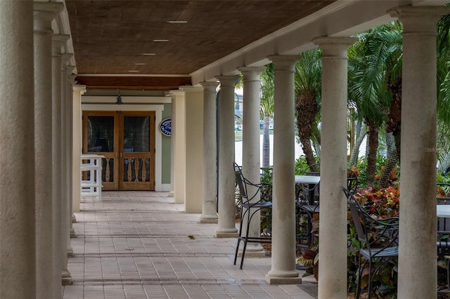 5102 Coastal Scene Dr, Apollo Beach, FL 33572 - property entrance with covered porch, a water view, and french doors