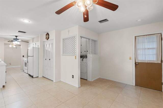 2956 Sutherland Ct, Palm Harbor, FL 34684 - spare room with ceiling fan, baseboards, light tile patterned flooring, and a smoke detector