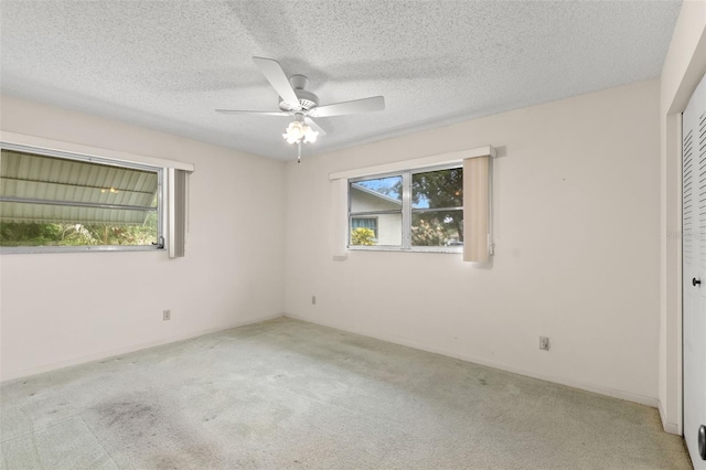 2956 Sutherland Ct, Palm Harbor, FL 34684 - unfurnished bedroom with light carpet, a closet, and a ceiling fan
