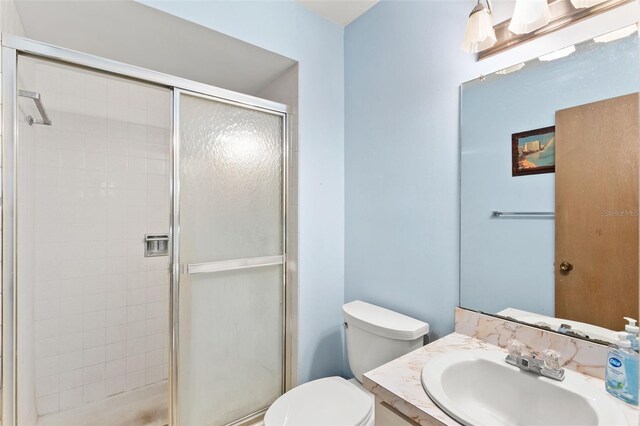 2956 Sutherland Ct, Palm Harbor, FL 34684 - full bathroom featuring a shower stall, toilet, and vanity