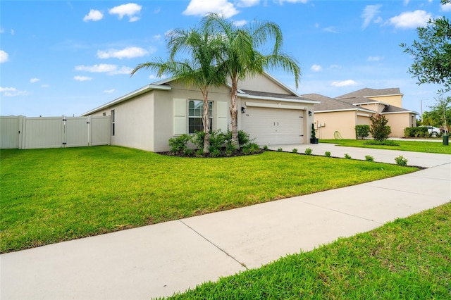 10512 Fuzzy Cattail St, Riverview, FL 33578 - view of front facade featuring a gate, stucco siding, driveway, and a garage