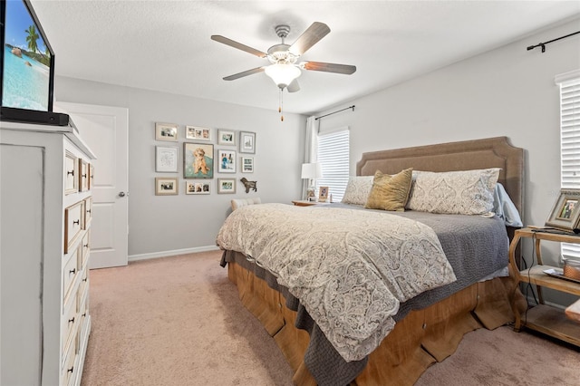 10512 Fuzzy Cattail St, Riverview, FL 33578 - bedroom featuring light colored carpet, baseboards, and a ceiling fan
