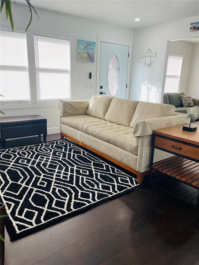 4049 Ponea Dr, Sarasota, FL 34241 - living area with healthy amount of natural light, wood finished floors, and recessed lighting