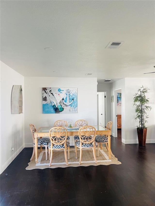 4049 Ponea Dr, Sarasota, FL 34241 - dining area featuring baseboards and wood finished floors