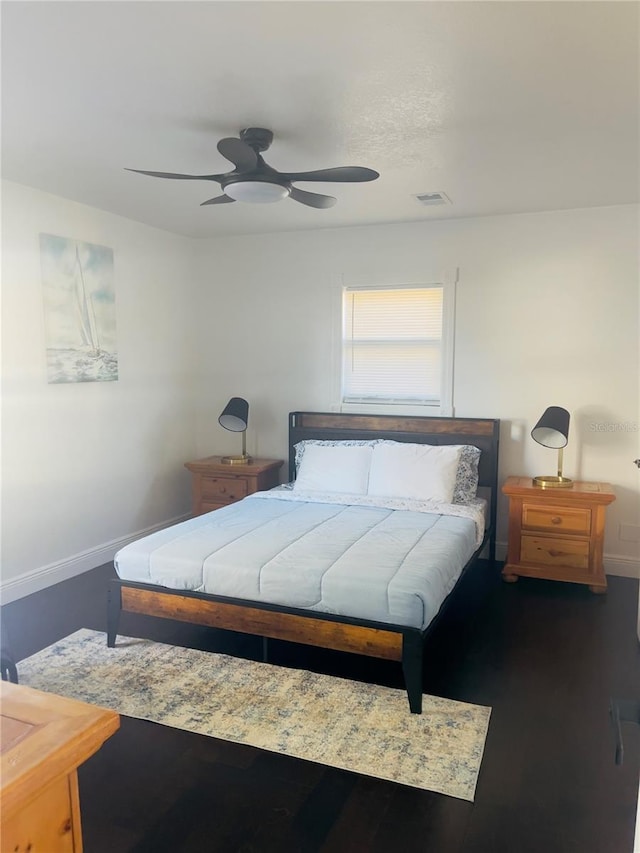 4049 Ponea Dr, Sarasota, FL 34241 - bedroom featuring baseboards, a ceiling fan, and wood finished floors