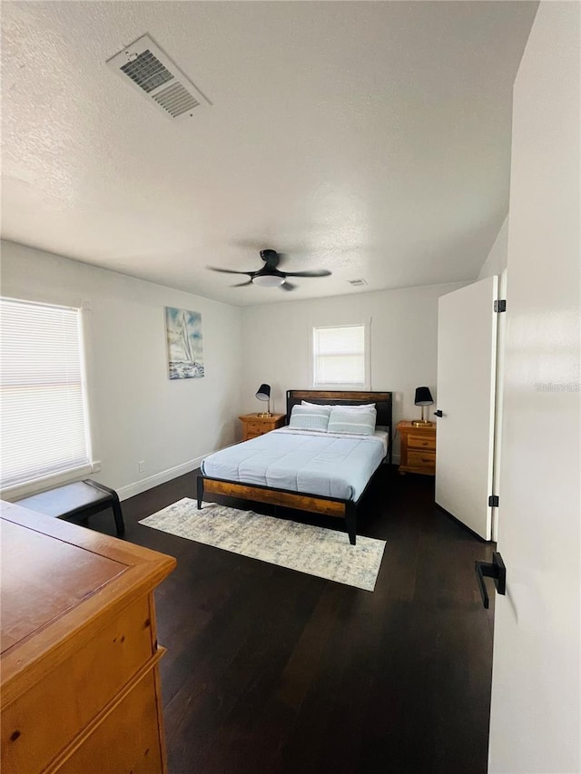 4049 Ponea Dr, Sarasota, FL 34241 - bedroom featuring baseboards, ceiling fan, and dark wood-style floors