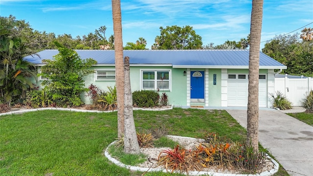 9929 Bay Dr, Gibsonton, FL 33534 - ranch-style house featuring a garage, stucco siding, and metal roof