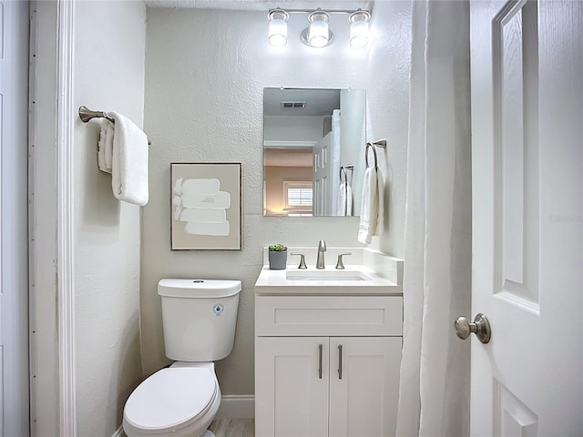 9929 Bay Dr, Gibsonton, FL 33534 - bathroom featuring vanity and toilet