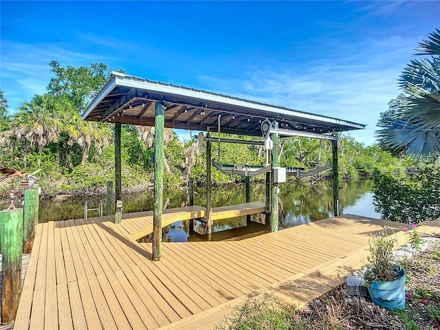 9929 Bay Dr, Gibsonton, FL 33534 - dock featuring boat lift and a water view