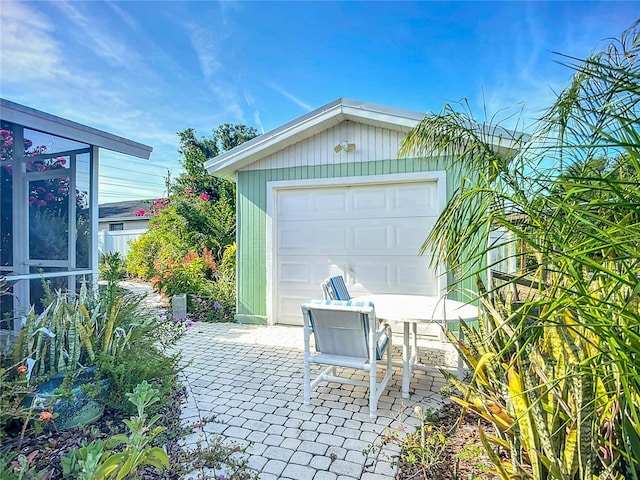 9929 Bay Dr, Gibsonton, FL 33534 - detached garage featuring driveway