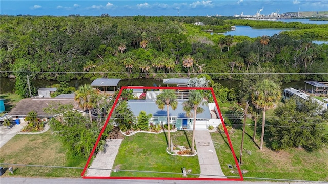 9929 Bay Dr, Gibsonton, FL 33534 - view from above of property featuring property parcel outlined, a nearby body of water, and a forest