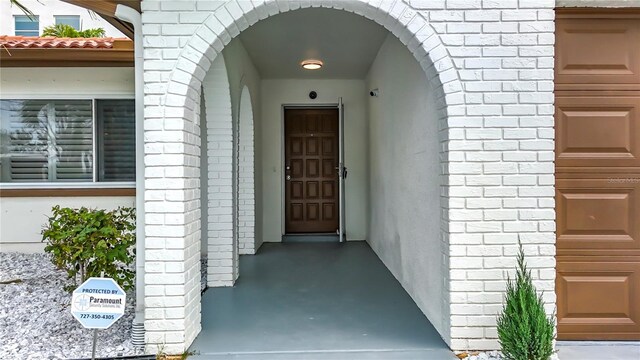 7125 S Shore Dr S, Saint Petersburg, FL 33707 - view of exterior entry with brick siding